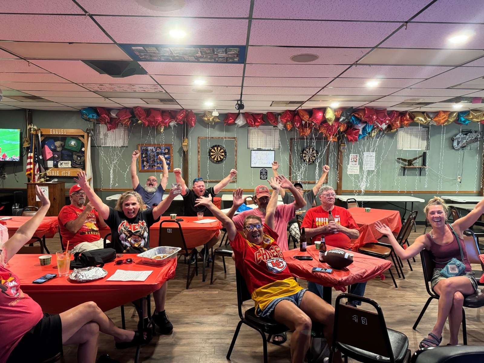 Members cheering on the Chiefs at the Aerie